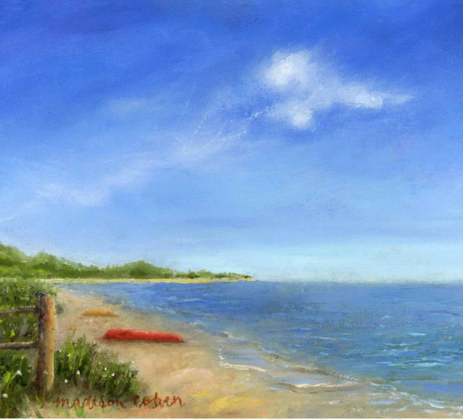 A red kayak pulled up on a wide sandy beach beside a weathered fence post, under a pale blue sky with a distant green headland across the water.