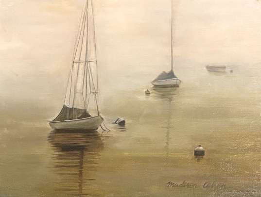 Three small sailboats lying at anchor in thick morning fog, their masts and reflections dissolving into a pale gold haze above still water.