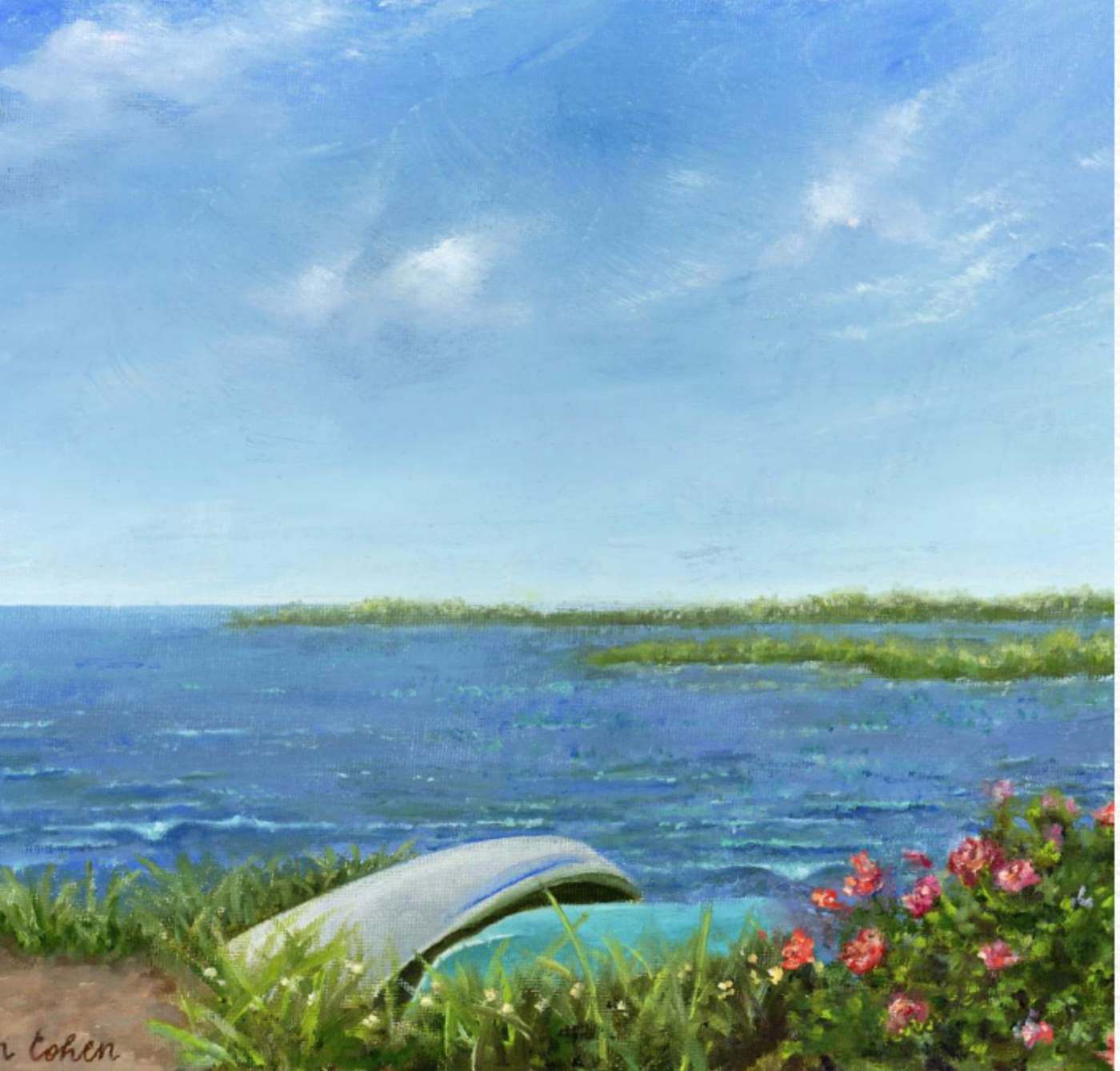 An overturned white dinghy resting in beach grass above calm blue water, with wild pink roses in bloom on the right and a low green shoreline along the horizon.